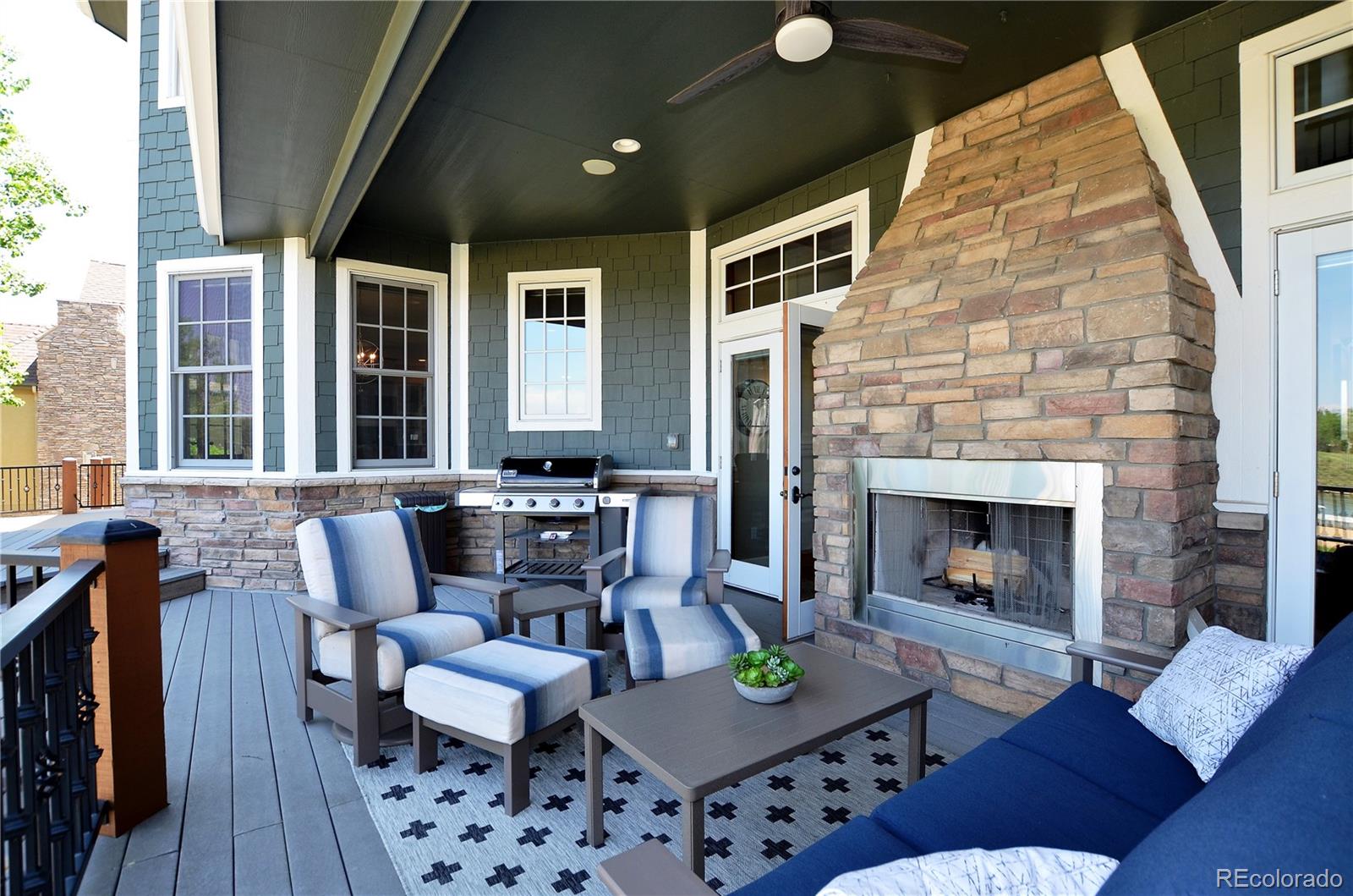 1820 Seashell Court Windsor, CO 80550 - Photo 33 of 40 a living room with furniture and a fireplace