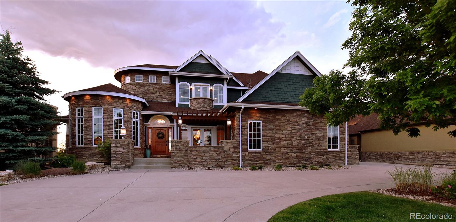 1820 Seashell Court Windsor, CO 80550 - Photo 4 of 40 a front view of a house with yard