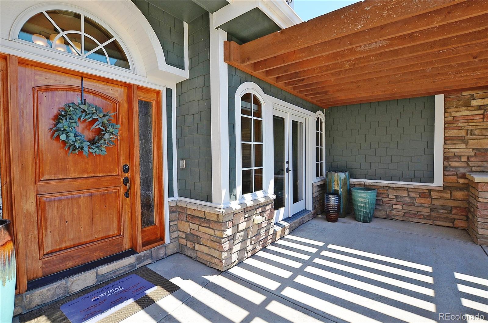 1820 Seashell Court Windsor, CO 80550 - Photo 5 of 40 a view of front door with outdoor seating