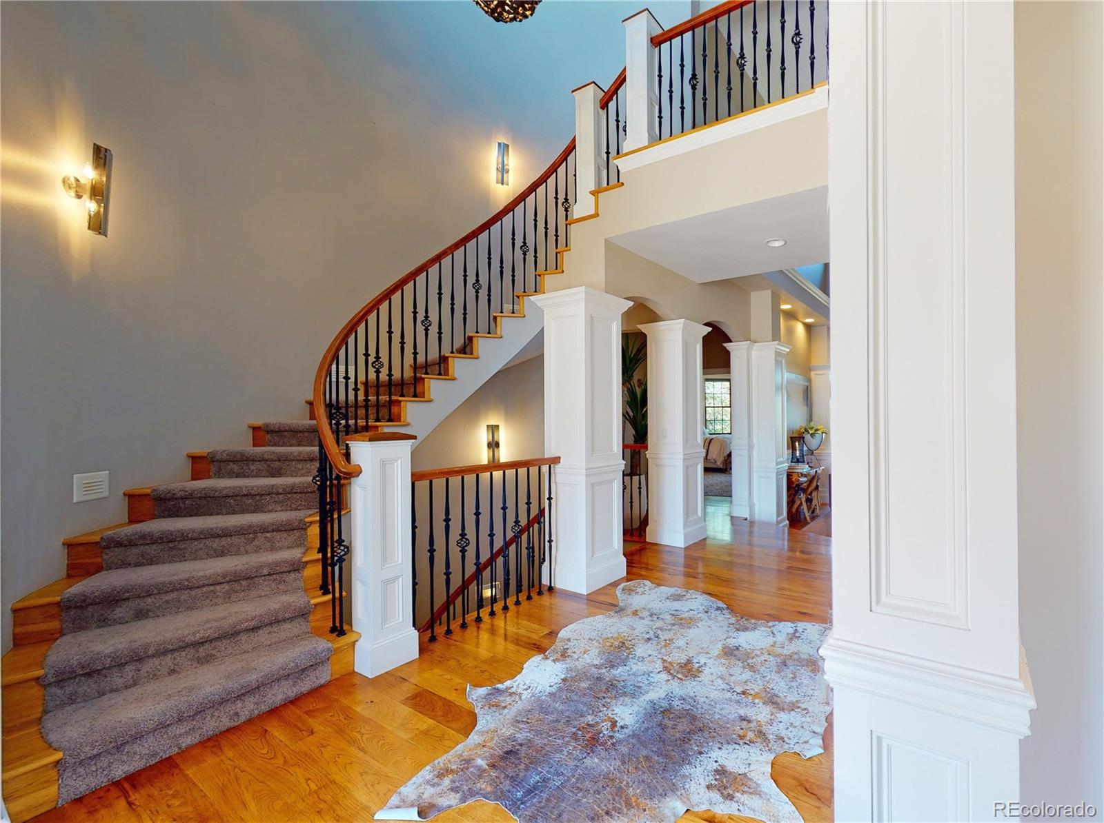 1820 Seashell Court Windsor, CO 80550 - Photo 6 of 40 a view of entryway and hall with wooden floor