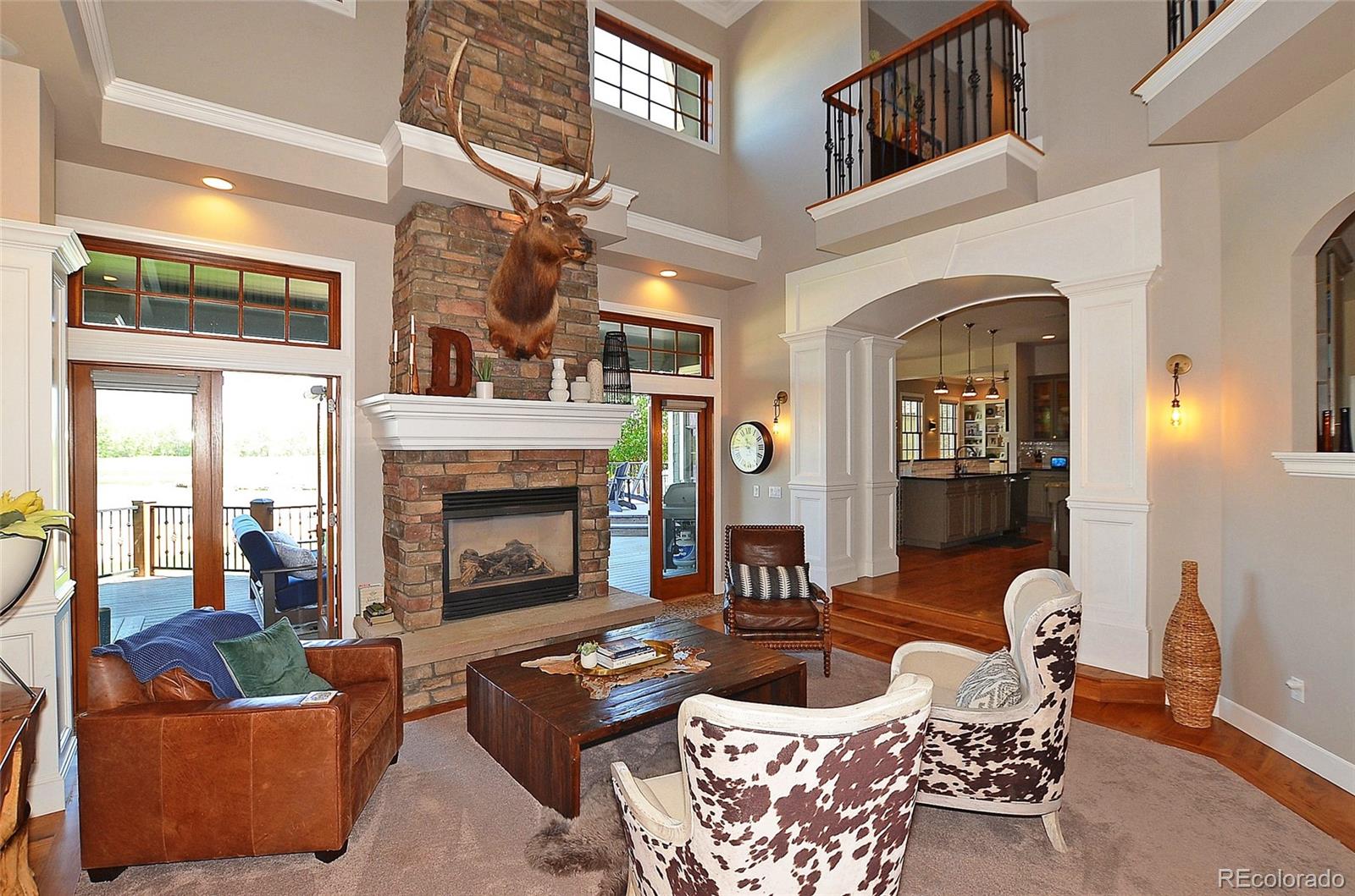 1820 Seashell Court Windsor, CO 80550 - Photo 7 of 40 a living room with furniture and a fireplace