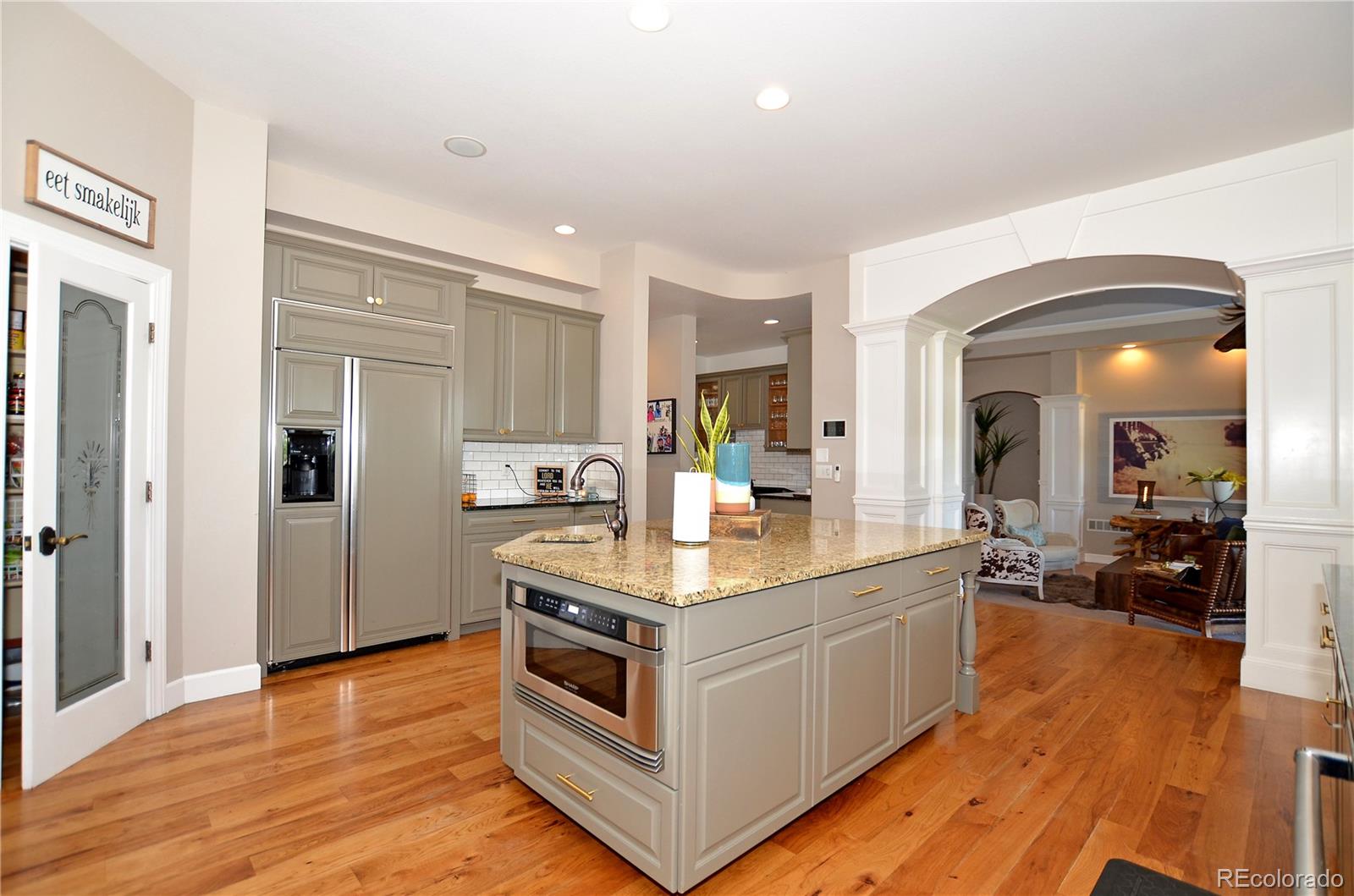 1820 Seashell Court Windsor, CO 80550 - Photo 9 of 40 a view of living room with furniture and wooden floor