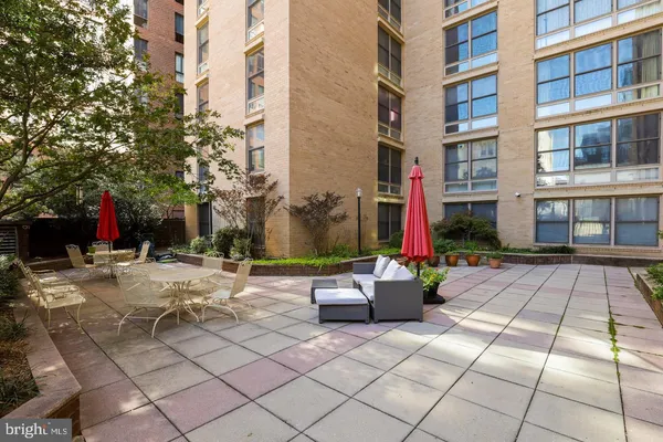 a view of a backyard with sitting area