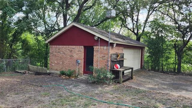a view of an house with backyard space and garden