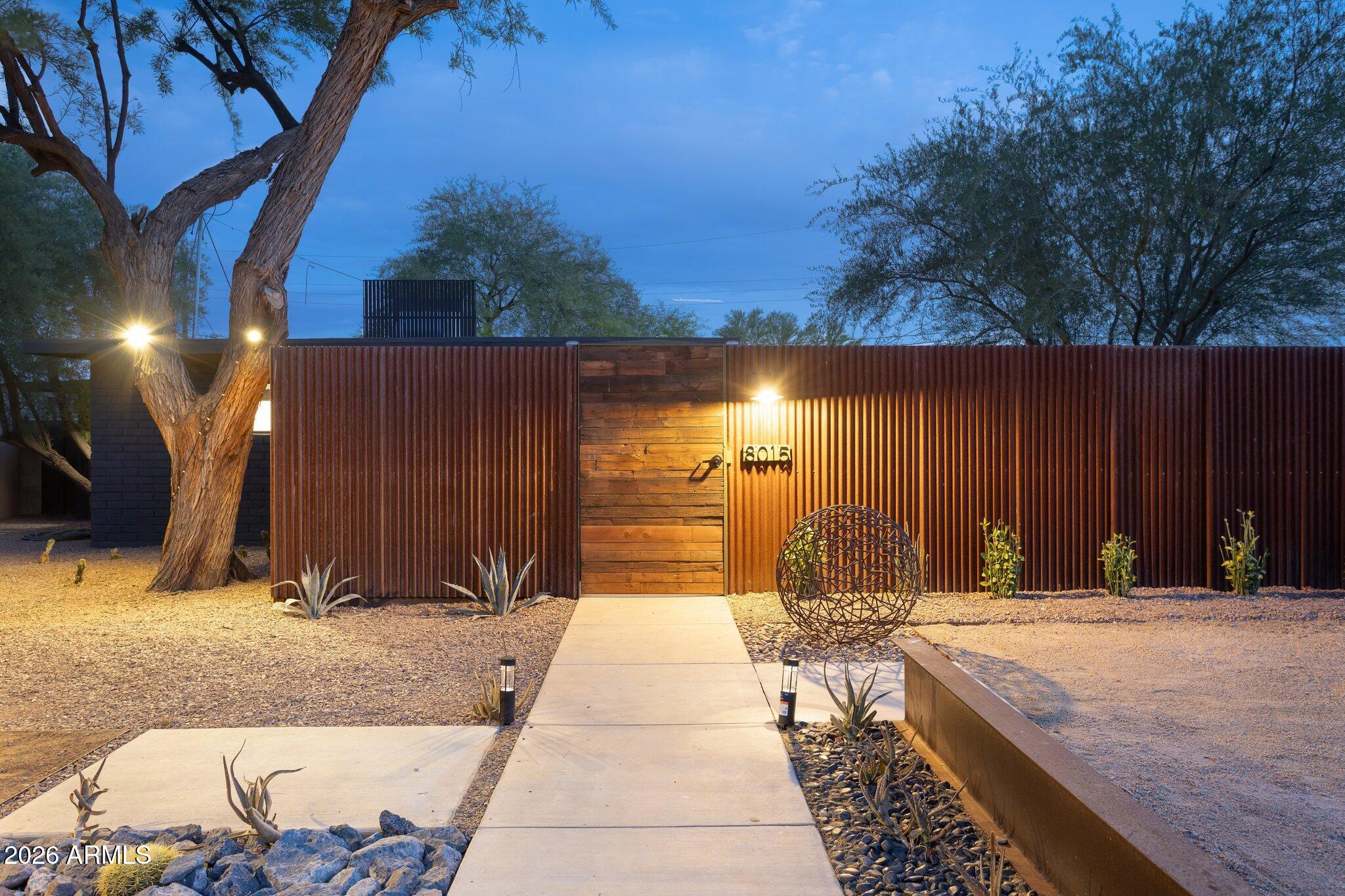 8015 East Coronado Road Scottsdale, AZ 85257 - Photo 36 of 93 Entry wall and gate at dusk