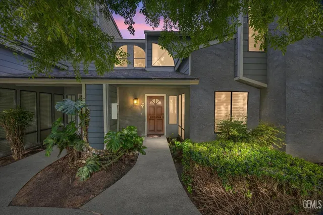 front view of a house with potted plants