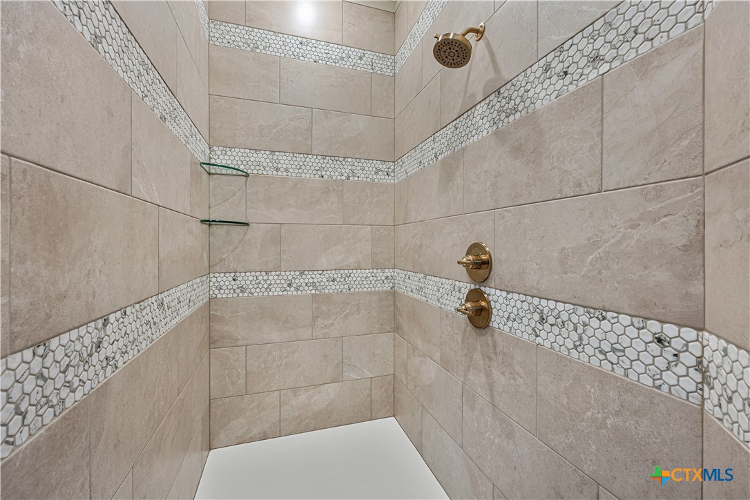 2136 Oak Draw Court Belton, TX 76513 - Photo 22 of 46 a bathroom with a shower