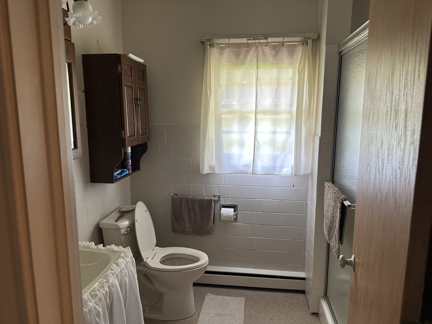 107 Towne Street Morrison, IL 61270 - Photo 11 of 29 a bathroom with a toilet and a shower