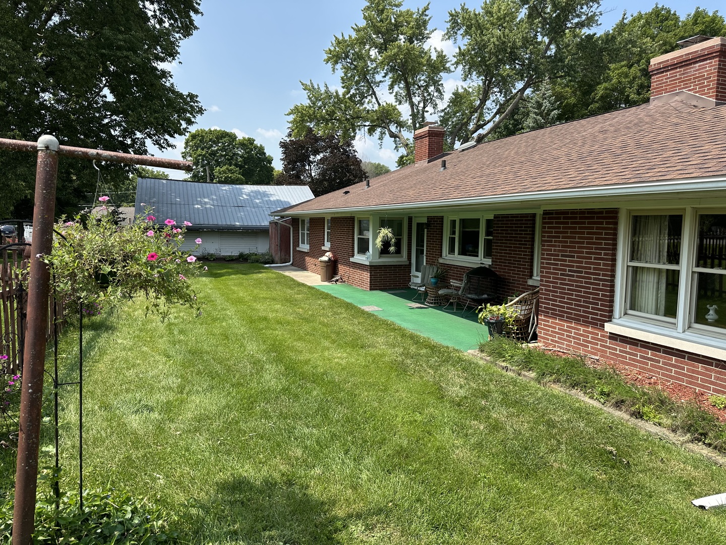 107 Towne Street Morrison, IL 61270 - Photo 28 of 29 a view of a house with backyard porch and sitting area