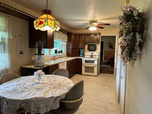 a kitchen with sink and refrigerator