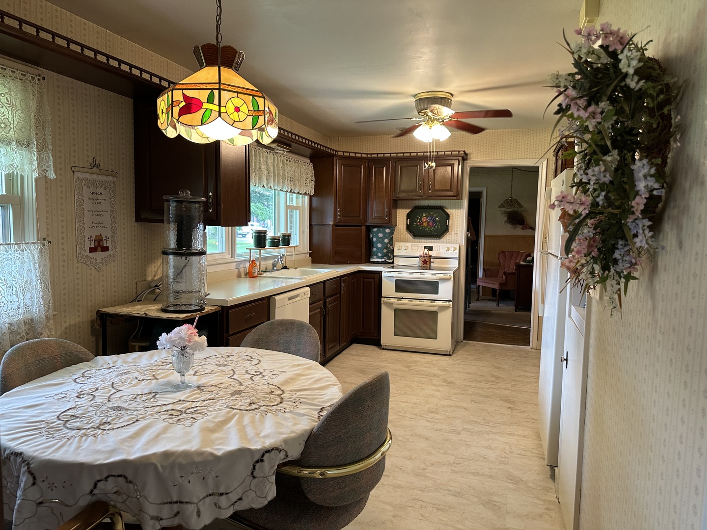 107 Towne Street Morrison, IL 61270 - Photo 7 of 29 a large kitchen with a table and chairs in it