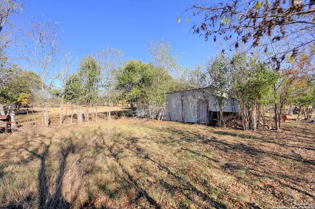 a backyard of a house with lots of green space