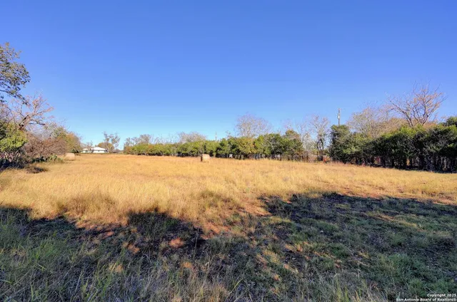 a view of lake with green space