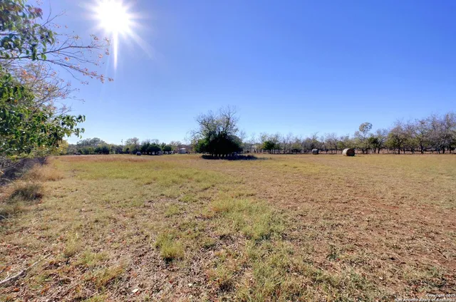 a view of lake with sunset in background