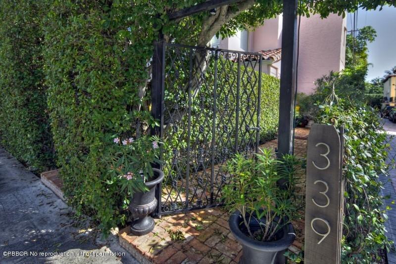 339 Cocoanut Row Palm Beach, FL 33480 - Photo 2 of 25 a sign that is on a brick wall