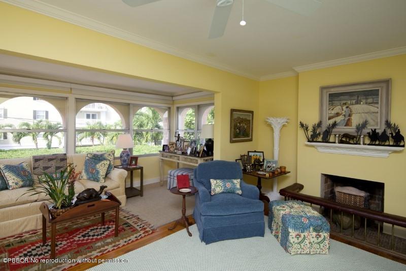339 Cocoanut Row Palm Beach, FL 33480 - Photo 12 of 25 a living room with furniture a fireplace and a large window