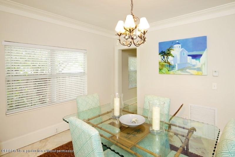 339 Cocoanut Row Palm Beach, FL 33480 - Photo 14 of 25 a view of a dining room with furniture and chandelier