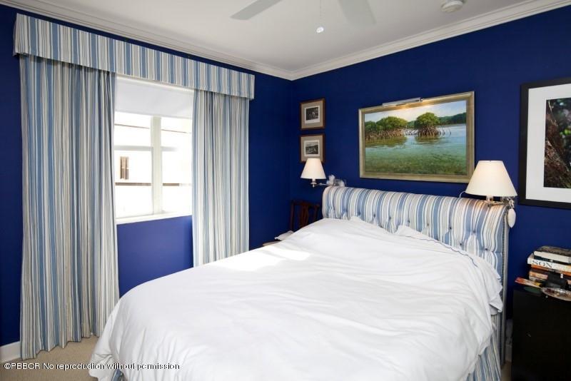 339 Cocoanut Row Palm Beach, FL 33480 - Photo 16 of 25 a large bed sitting in a bedroom next to a window