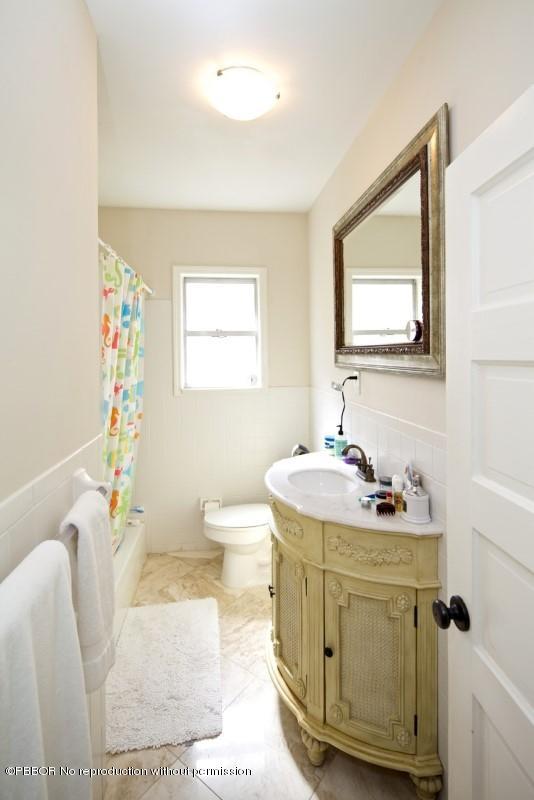 339 Cocoanut Row Palm Beach, FL 33480 - Photo 17 of 25 a bathroom with a sink a toilet and a mirror