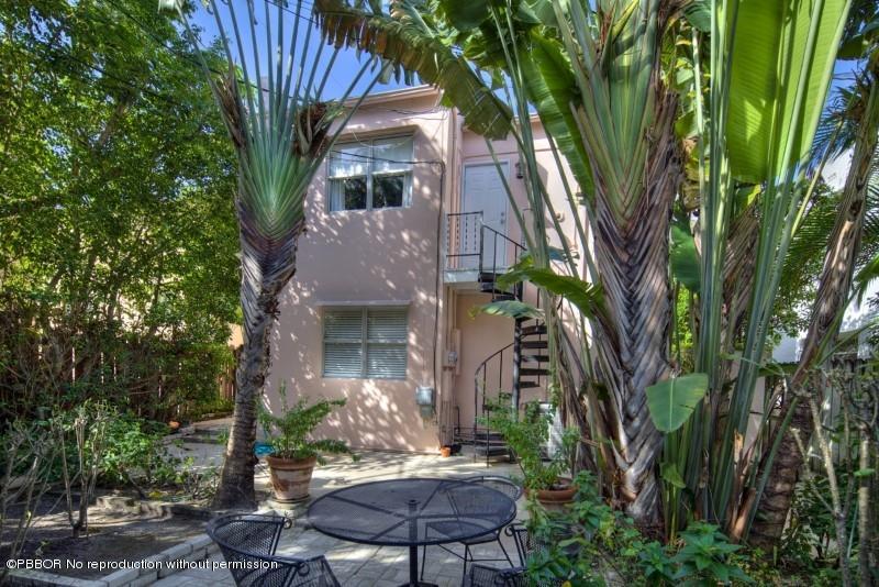 339 Cocoanut Row Palm Beach, FL 33480 - Photo 19 of 25 a front view of a house with garden
