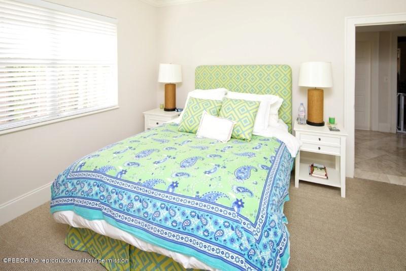 339 Cocoanut Row Palm Beach, FL 33480 - Photo 8 of 25 a bedroom with a bed chair and a window