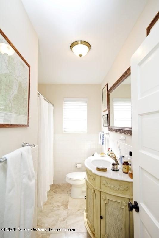 339 Cocoanut Row Palm Beach, FL 33480 - Photo 9 of 25 a bathroom with a sink and mirror with toilet