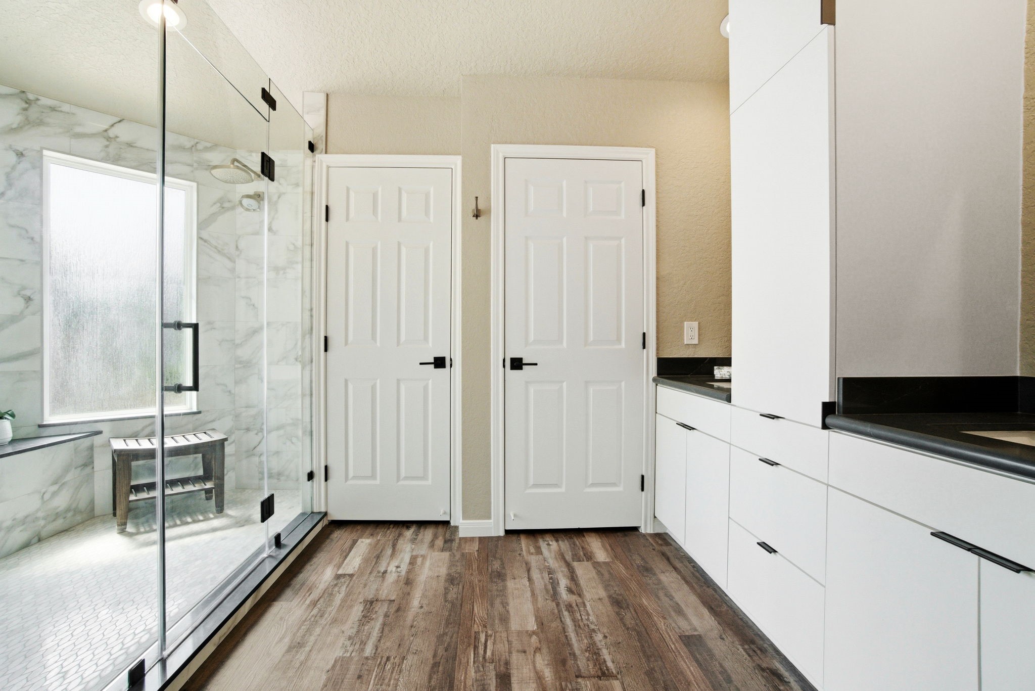 1609 Schooner Point Willis, TX 77318 - Photo 29 of 50 a bathroom with a double vanity sink a mirror and a shower