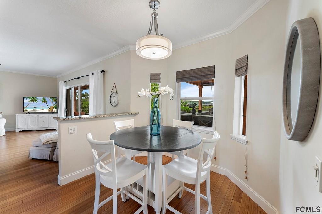7619 A1A South St. Augustine, FL 32080 - Photo 16 of 51 a dining room with furniture and window