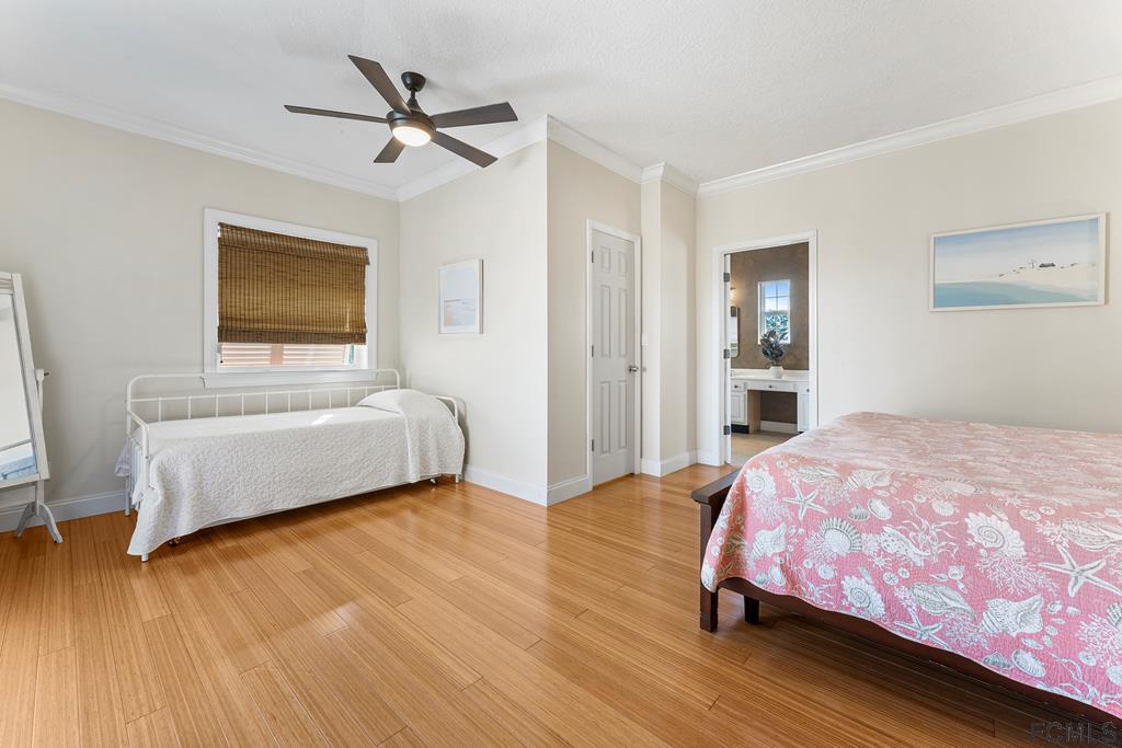 7619 A1A South St. Augustine, FL 32080 - Photo 17 of 51 a bedroom with a bed and a window