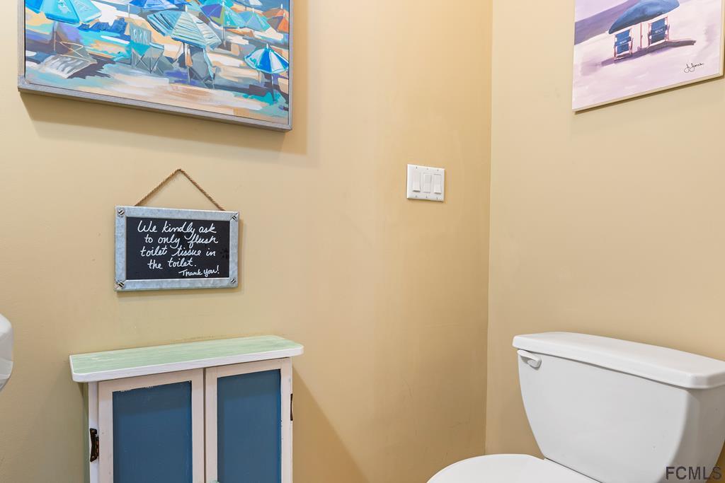 7619 A1A South St. Augustine, FL 32080 - Photo 24 of 51 a bathroom with a toilet and a shower