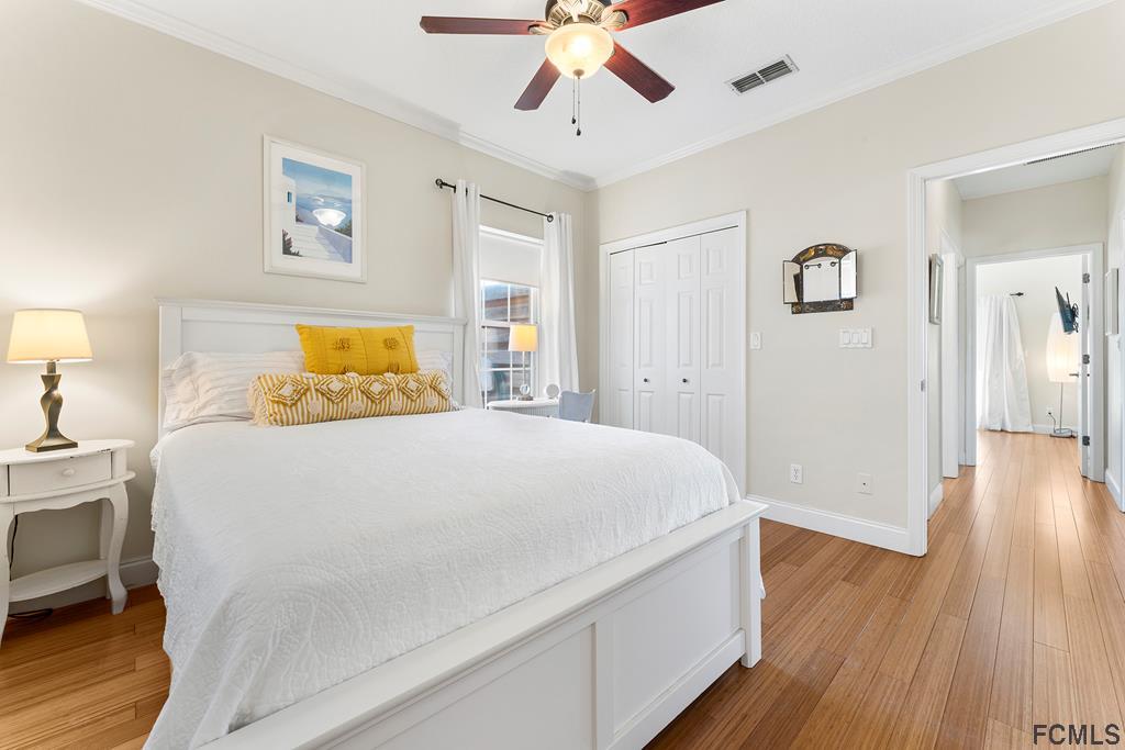 7619 A1A South St. Augustine, FL 32080 - Photo 29 of 51 a bedroom with a bed and wooden floor