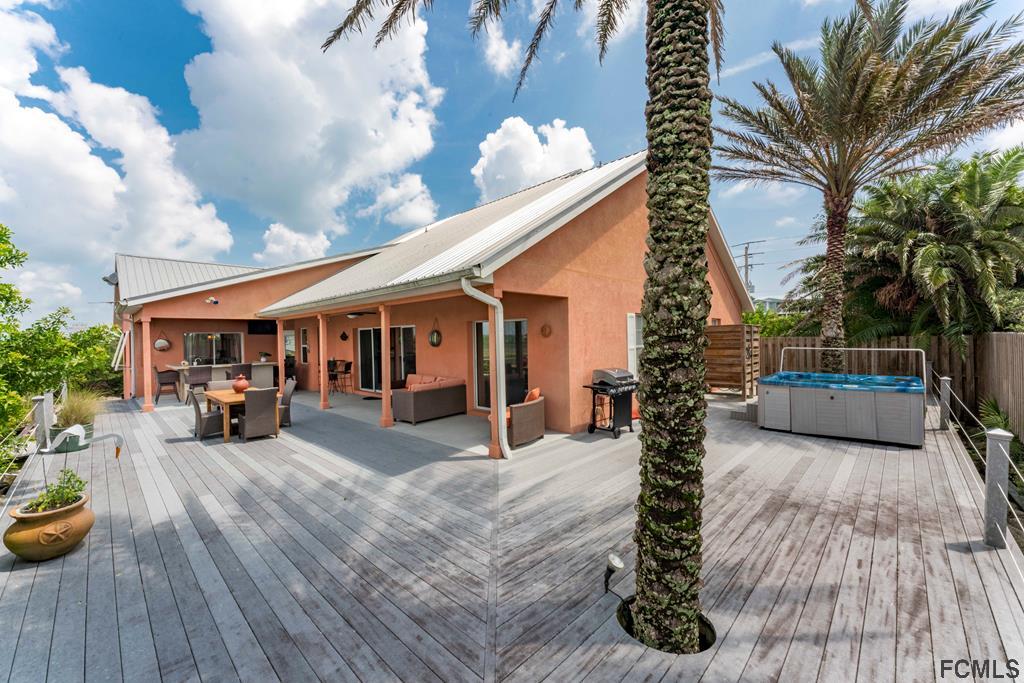 7619 A1A South St. Augustine, FL 32080 - Photo 33 of 51 a view of a house with sitting area and furniture