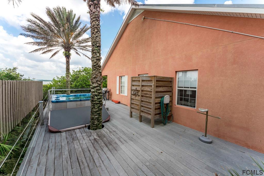 7619 A1A South St. Augustine, FL 32080 - Photo 34 of 51 a terrace with outdoor seating and wooden floor