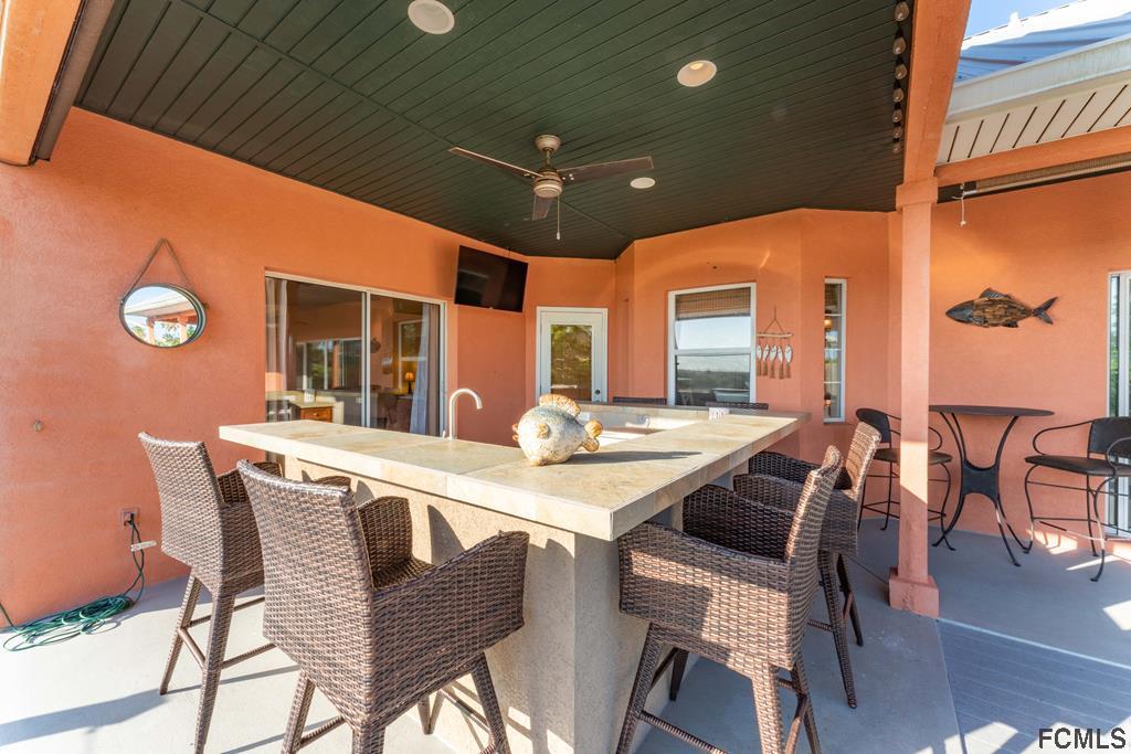 7619 A1A South St. Augustine, FL 32080 - Photo 36 of 51 a view of a dining room with furniture and wooden floor