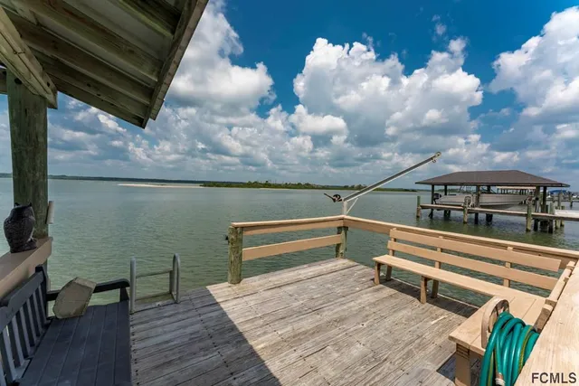 a view of a chairs and table in a patio