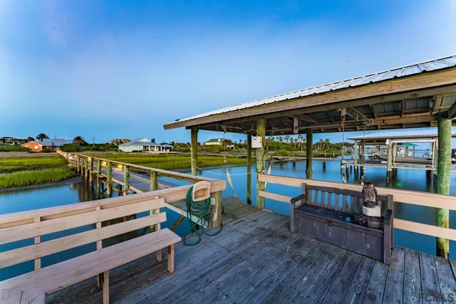 swimming pool view with a lake view in the background