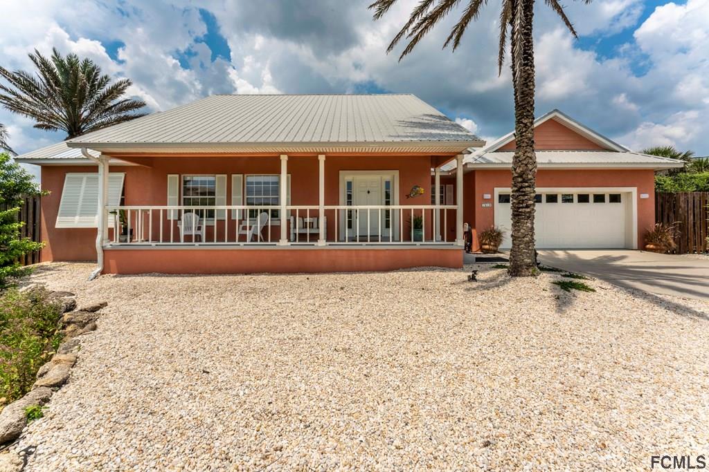 7619 A1A South St. Augustine, FL 32080 - Photo 5 of 51 a front view of a house with a yard