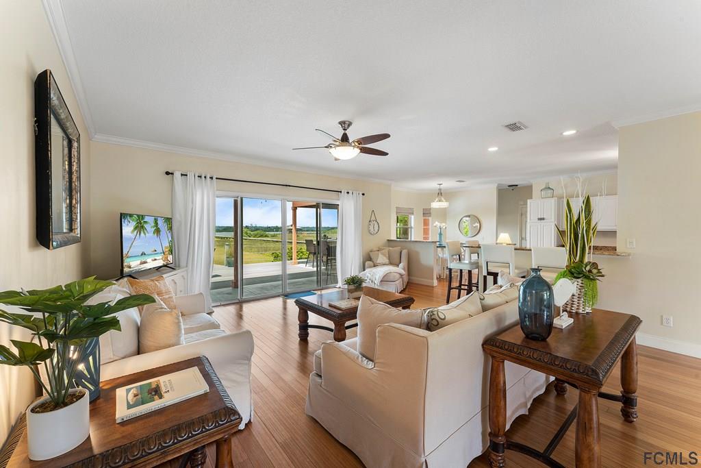 7619 A1A South St. Augustine, FL 32080 - Photo 9 of 51 a living room with furniture and a large window