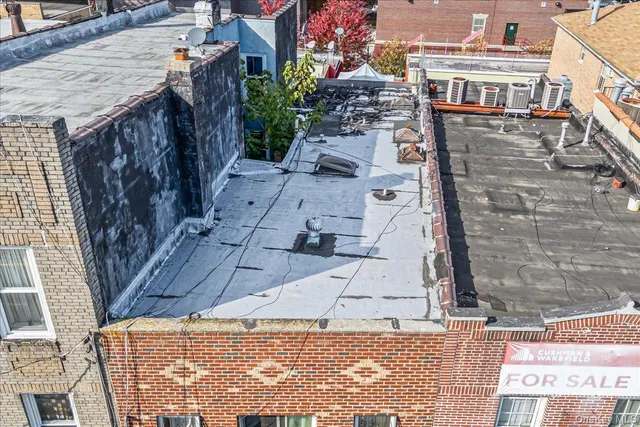 a aerial view of a building with sitting area