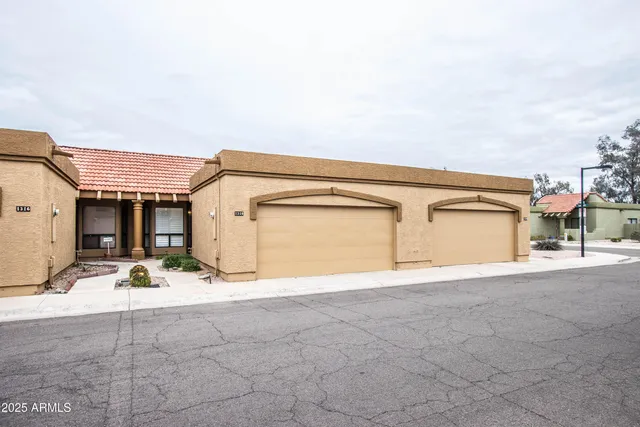 a kitchen with stainless steel appliances kitchen island granite countertop a stove refrigerator and cabinets