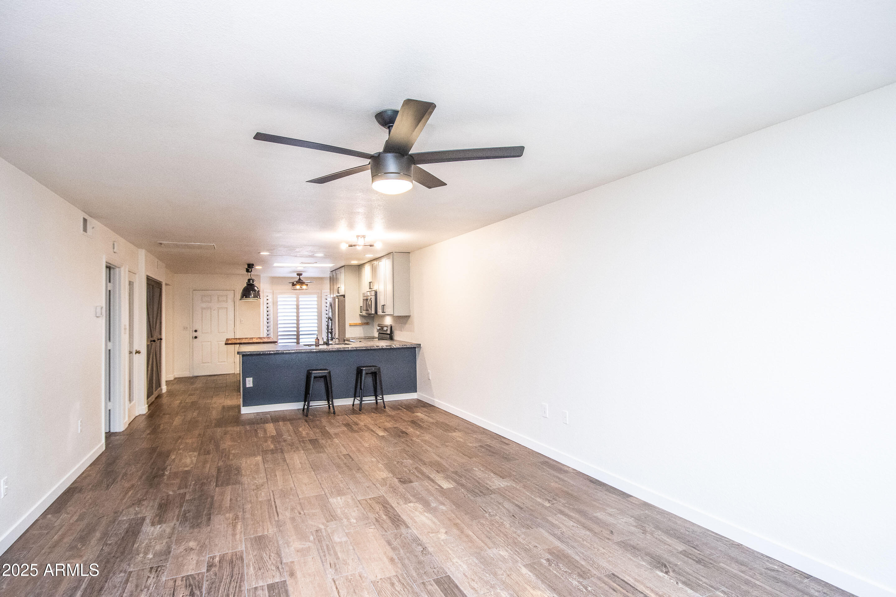 1318 East Cobb Drive Tempe, AZ 85288 - Photo 17 of 43 a view of workspace with wooden floor and window