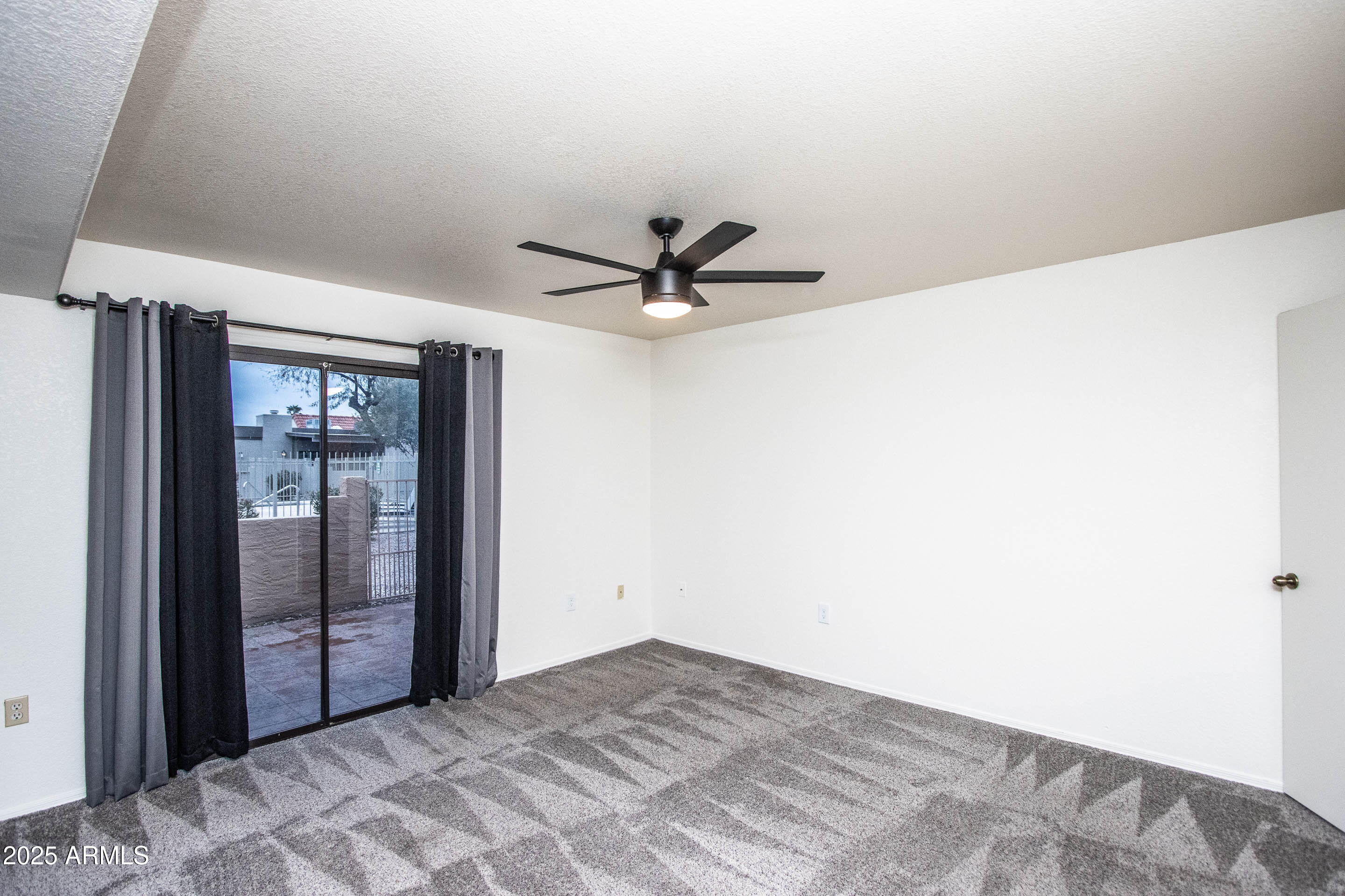 1318 East Cobb Drive Tempe, AZ 85288 - Photo 24 of 43 a view of a livingroom with a ceiling fan and window