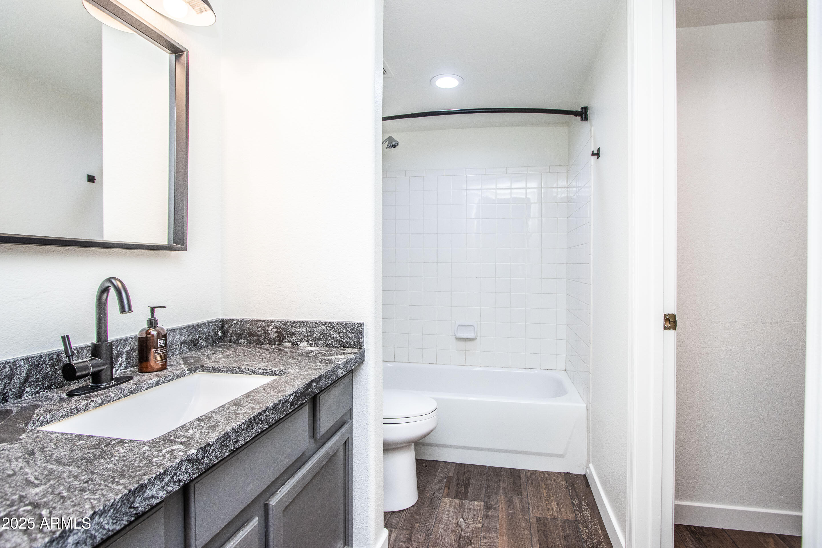 1318 East Cobb Drive Tempe, AZ 85288 - Photo 27 of 43 a bathroom with a granite countertop sink toilet and shower