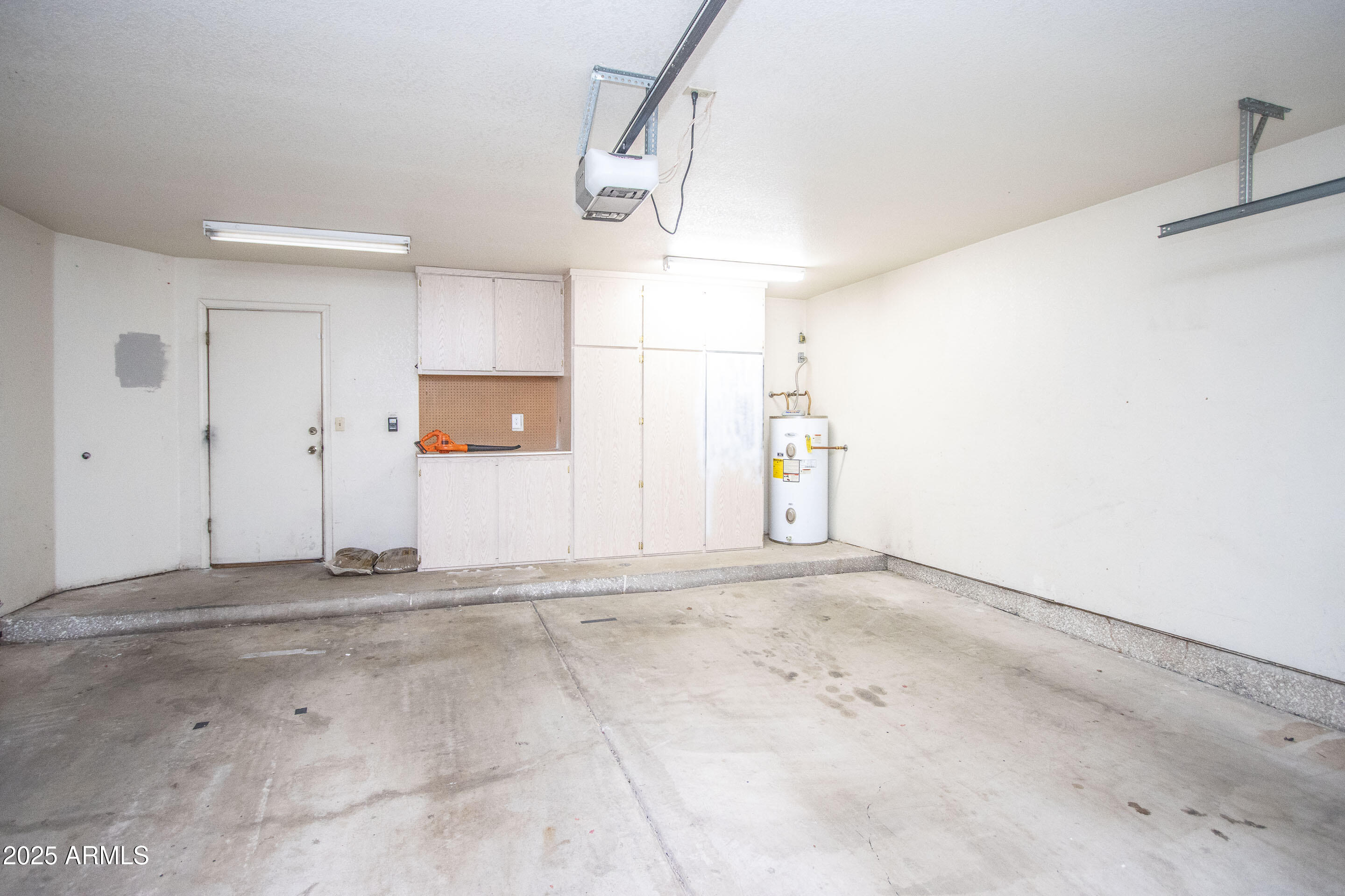 1318 East Cobb Drive Tempe, AZ 85288 - Photo 30 of 43 a view of a room with rack on the wall