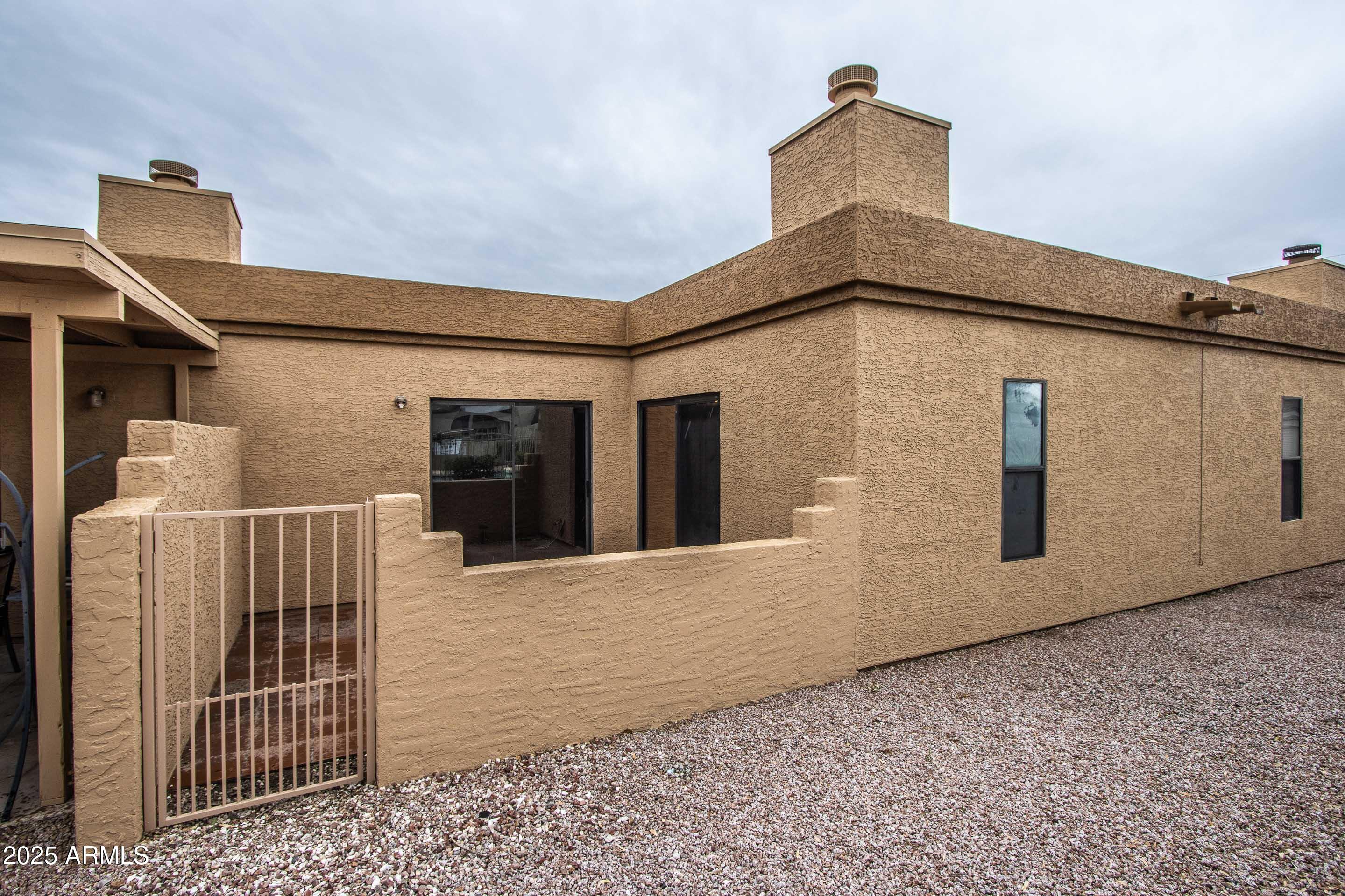 1318 East Cobb Drive Tempe, AZ 85288 - Photo 35 of 43 a view of a house with a door
