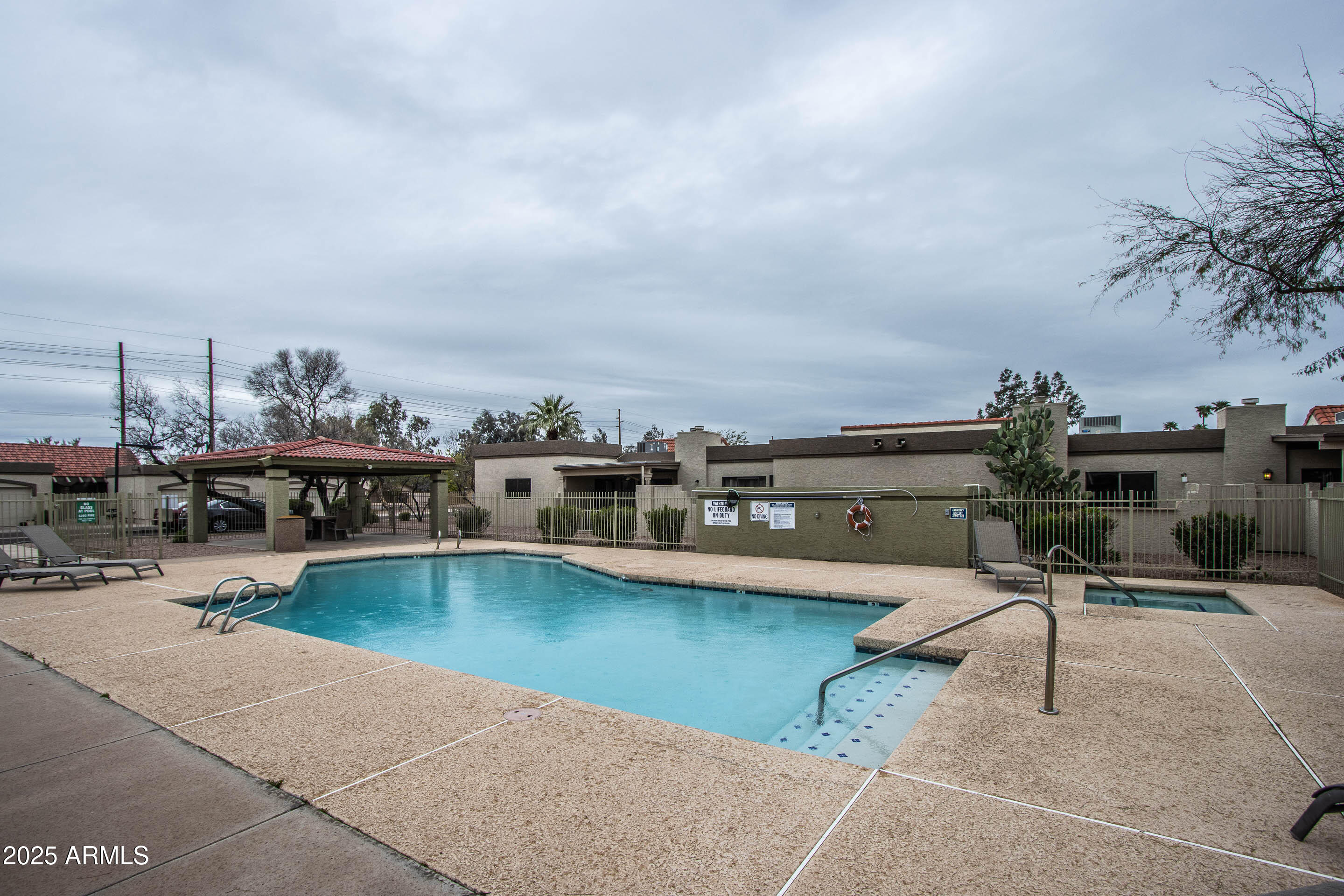 1318 East Cobb Drive Tempe, AZ 85288 - Photo 36 of 43 a view of a swimming pool with outdoor seating