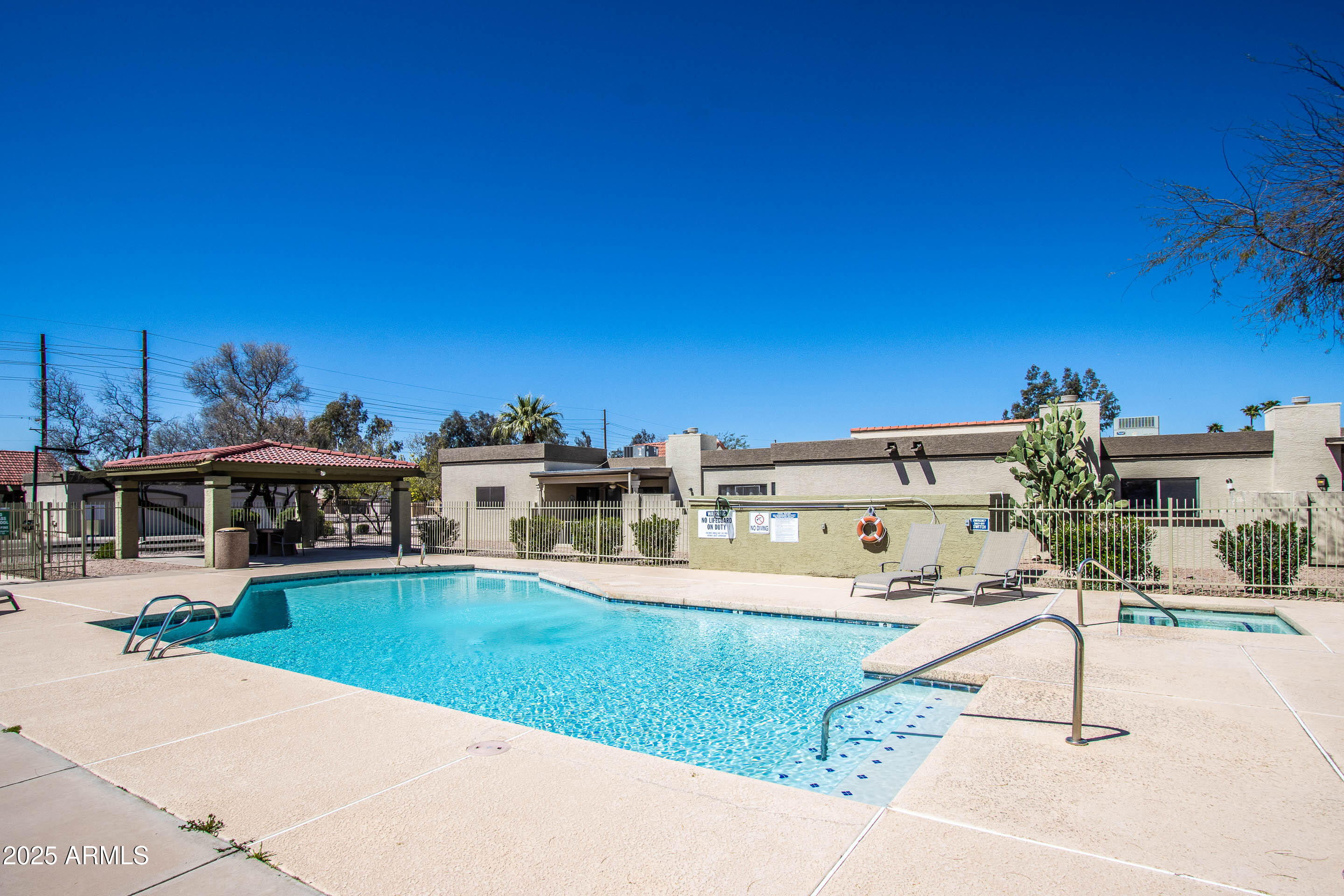 1318 East Cobb Drive Tempe, AZ 85288 - Photo 37 of 43 a view of a house with a backyard porch and sitting area