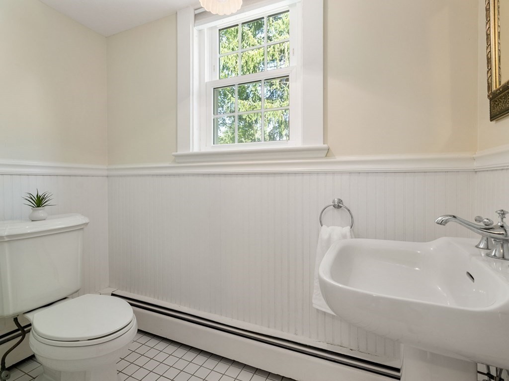 22 Howe Road Newton, MA 02459 - Photo 14 of 31 a bathroom with a sink and a toilet