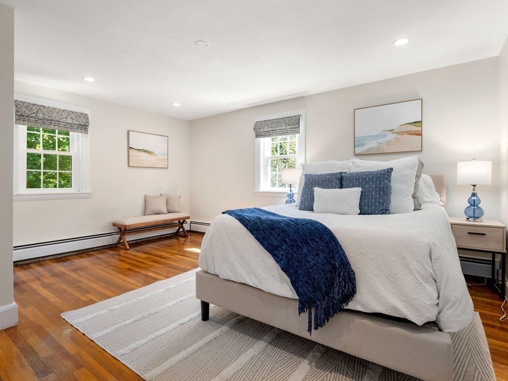 22 Howe Road Newton, MA 02459 - Photo 15 of 31 a bedroom with a bed and a table in it with window