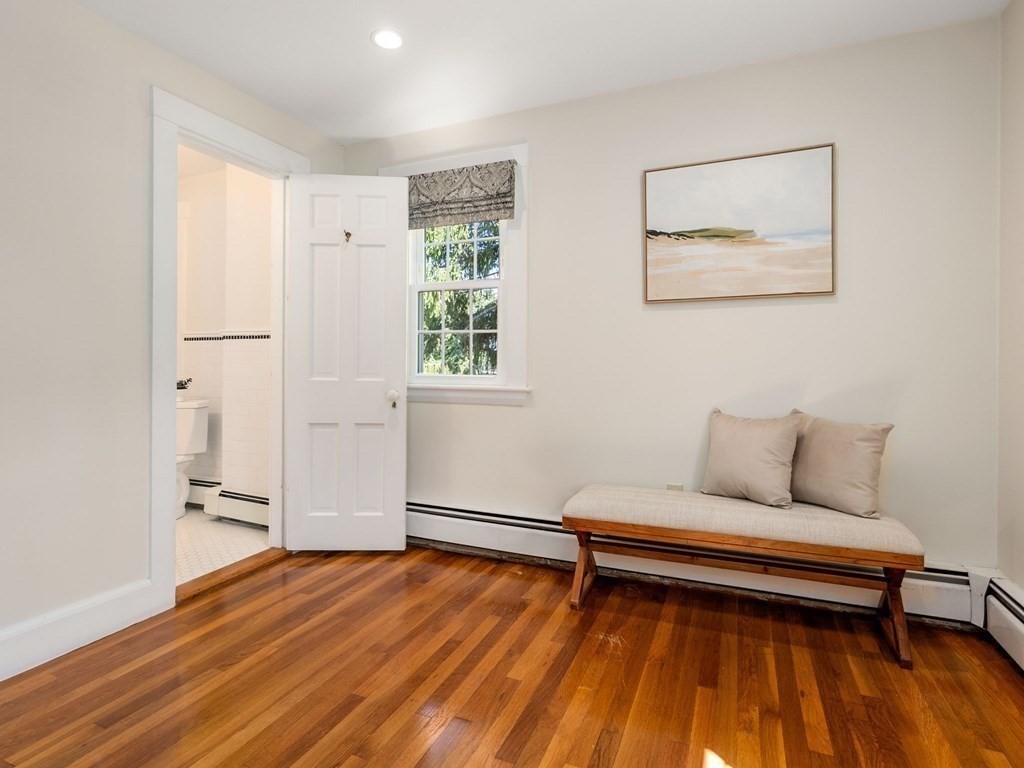 22 Howe Road Newton, MA 02459 - Photo 16 of 31 a living room with furniture and a wooden floor